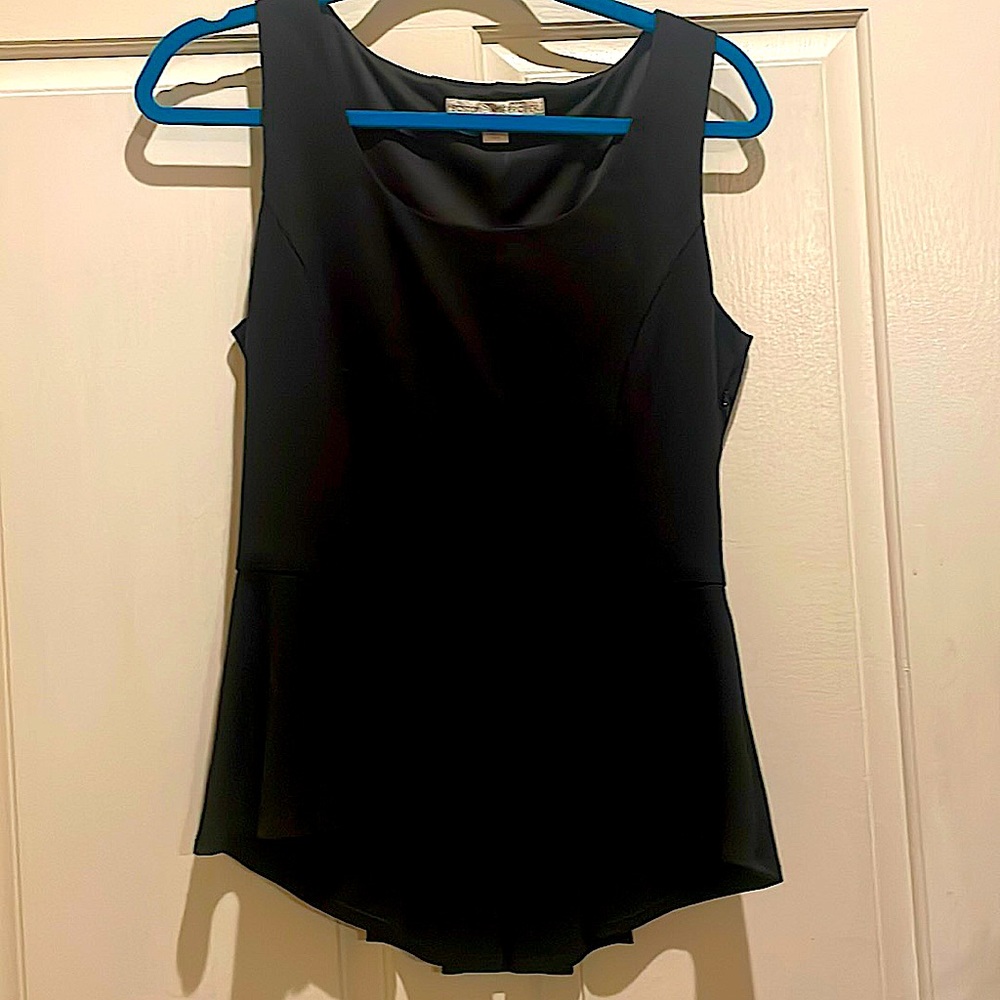 Black sleeveless top with peplum